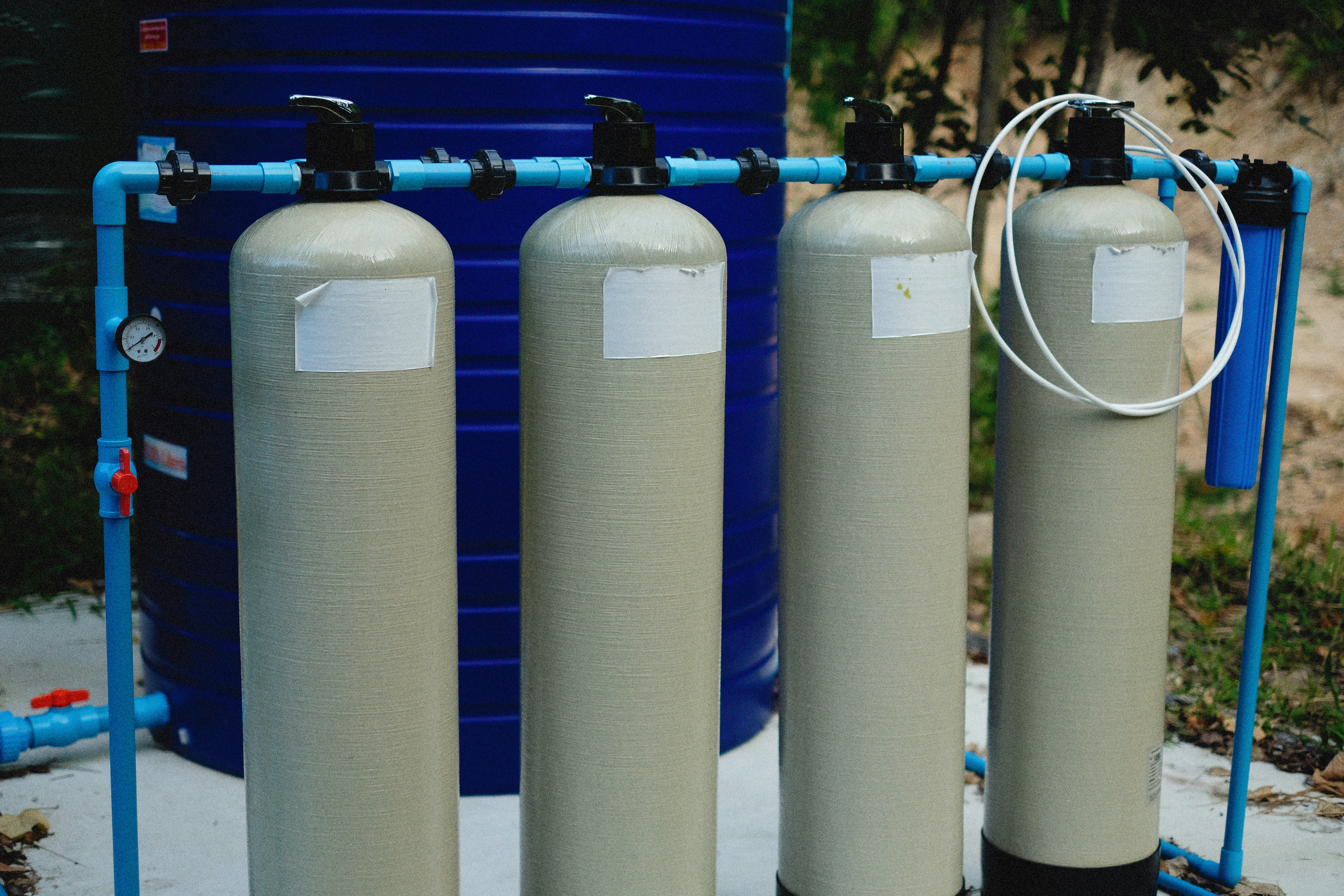 Technician installing home filtration equipment